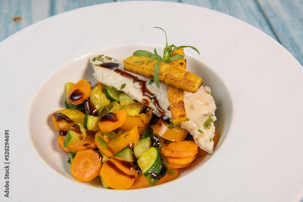 Fish recipe, fillet of sea bass with small vegetables, High quality photo Fish recipe, fillet of sea bass with small vegetables, High quality photo