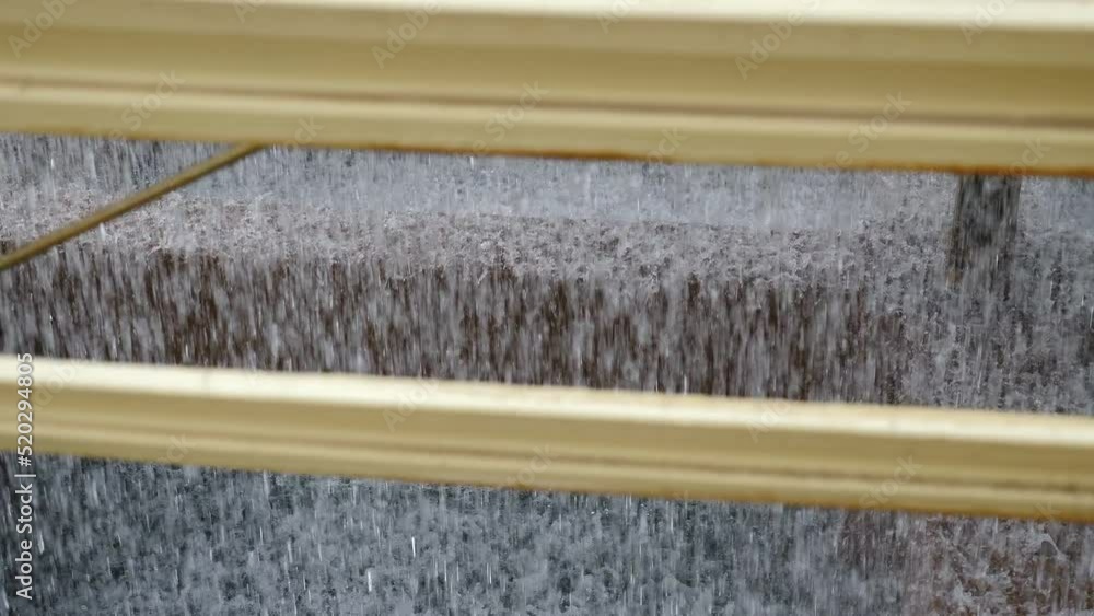 Water inside cooling tower. Inside view. Water droplets inside cooling tower in factory. Water Coolant Dripping From Industrial Processing Machine For Stone Work. Water Drops From Processing Machine