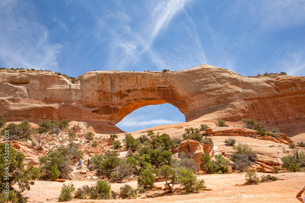 Wilson Arch in a semi desert landscape in Moab Utah