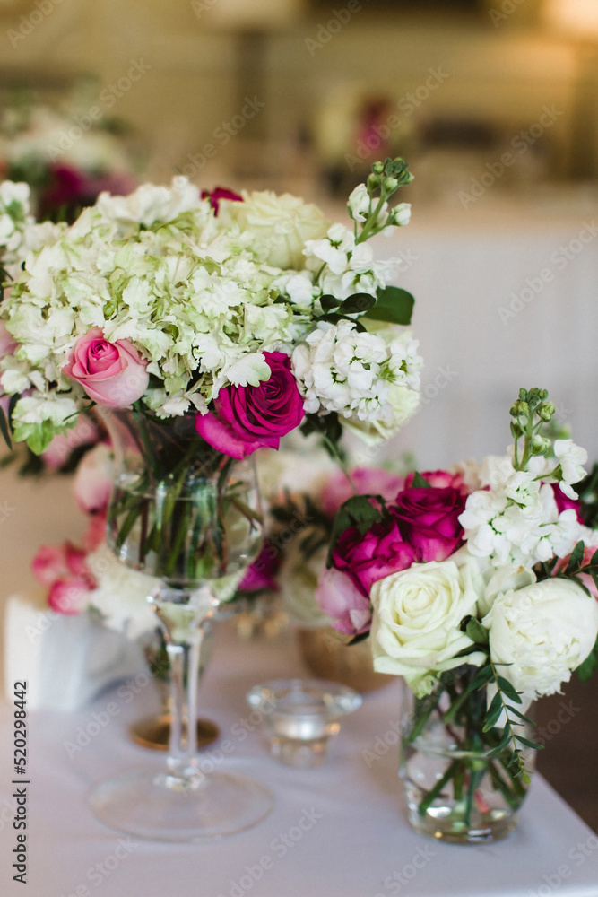Bouquet of flowers in vase on the wedding table Bouquet of flowers in vase on the wedding table