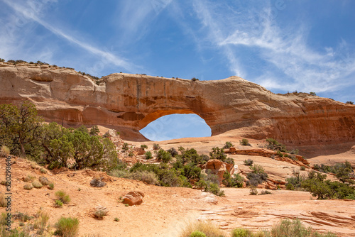 Wilson Arch in semi desert landscape in Moab Utah