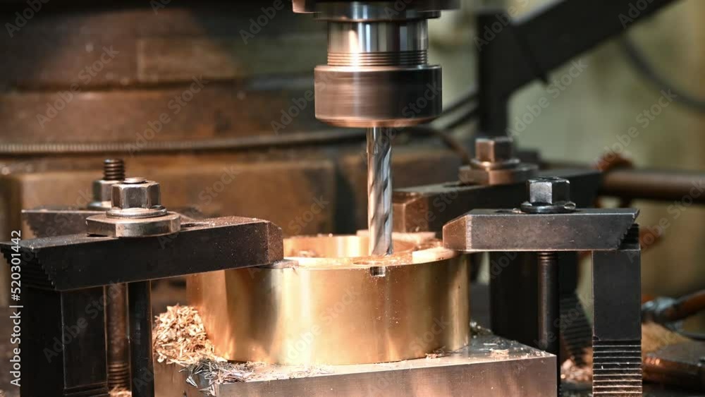 High resolution the plunge milling process the brass ring part on NC milling machine. High resolution the plunge milling process the brass ring part on NC milling machine.
