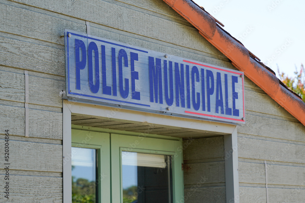Municipal police facade wall logo and text sign on entrance official building of mayor local police municipale