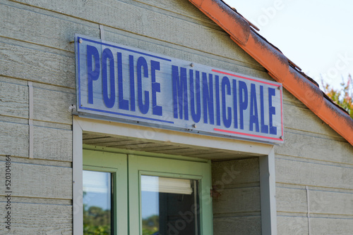 Municipal police facade wall logo and text sign on entrance official building of mayor local police municipale