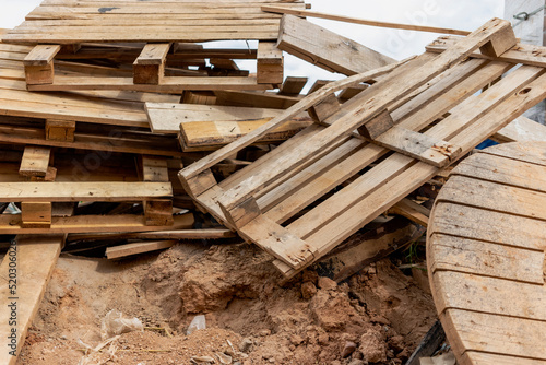 Wooden pallet close-up at a construction site. Reuse of wooden pallets.