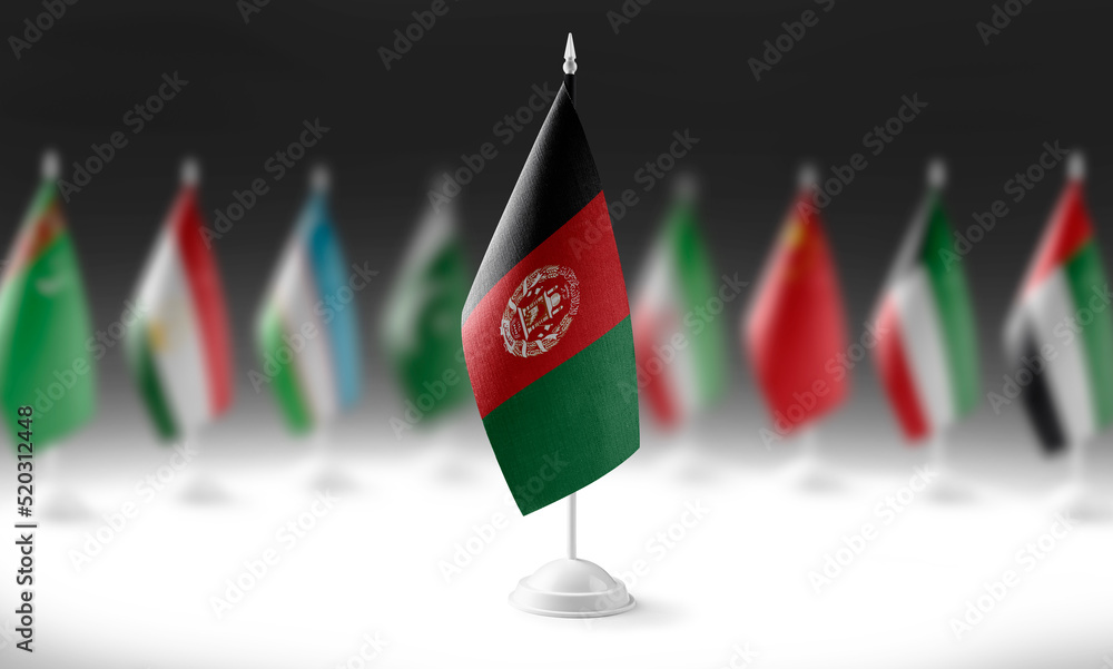 The national flag of the Afghanistan on the background of flags of ...