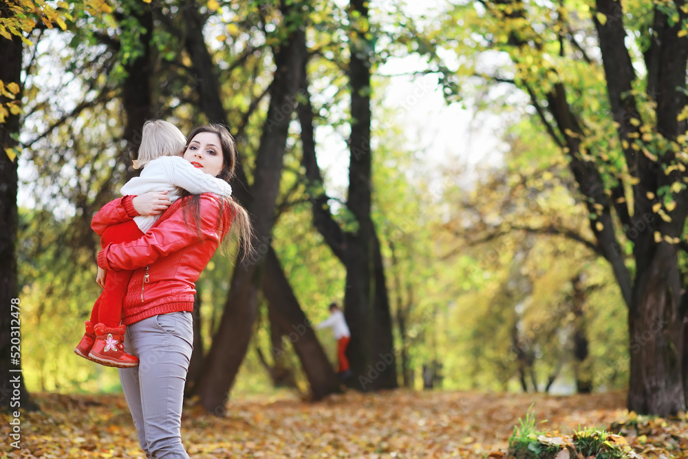 Children for a walk in the autumn park. Leaf fall in the park. Family. Fall. Happiness. Children for a walk in the autumn park. Leaf fall in the park. Family. Fall. Happiness.