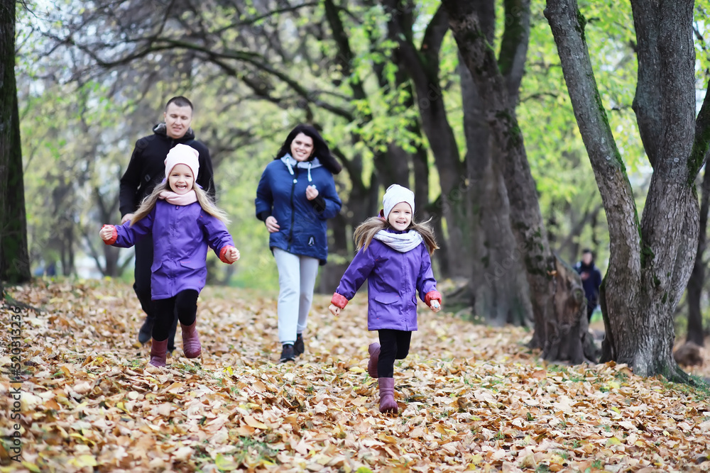 Leaf fall in the park. Children for a walk in the autumn park. Family. Fall. Happiness. Leaf fall in the park. Children for a walk in the autumn park. Family. Fall. Happiness.