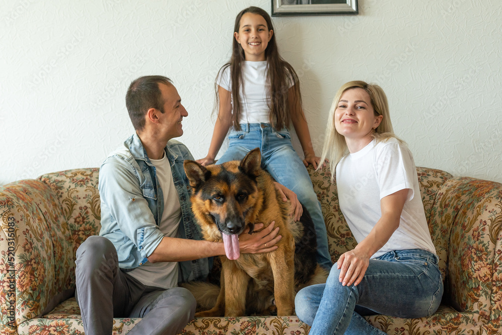 german shepherd and family. German shepherd is the best friend of the child.