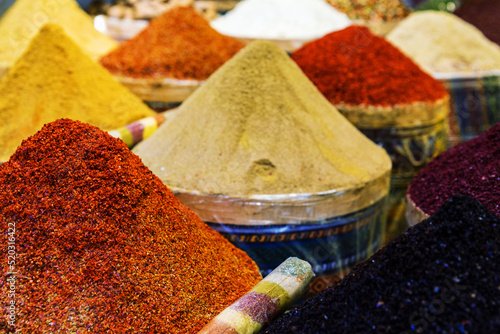 Spices Market with colourful mood. Multicolor spices sold at Egypt Bazaar (Misir Carsisi) in Istanbul, Turkey (Turkiye). Selected focus, copy space, colorful background