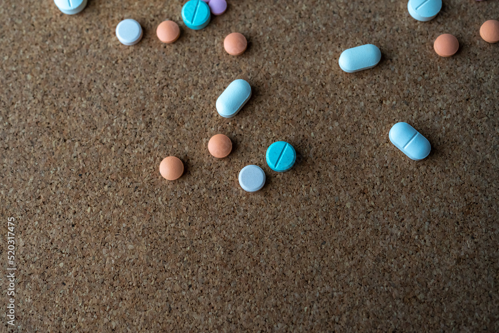 Pharmaceutical medicine pills in both tablets and capsules with the vintage retro picture style. Pharmacy theme and treatment medication as concept. Pharmaceutical medicine pills in both tablets and capsules with the vintage retro picture style. Pharmacy theme and treatment medication as concept.