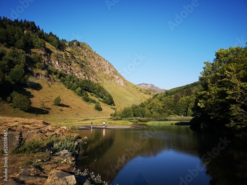 landscape in the mountains with meadow and lake in Pyrenees