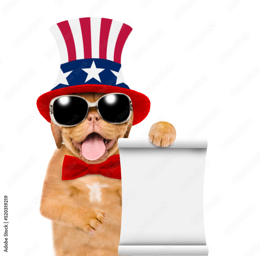 Happy Mastiff puppy wearing like Uncle Sam with sunglasses shows empty list. isolated on white background