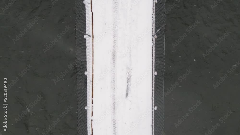 Top Down Shot of Snow-covered Bridge Across a River Top Down Shot of Snow-covered Bridge Across a River