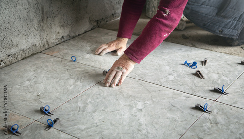 Laying floor ceramic tile. Renovating the floor