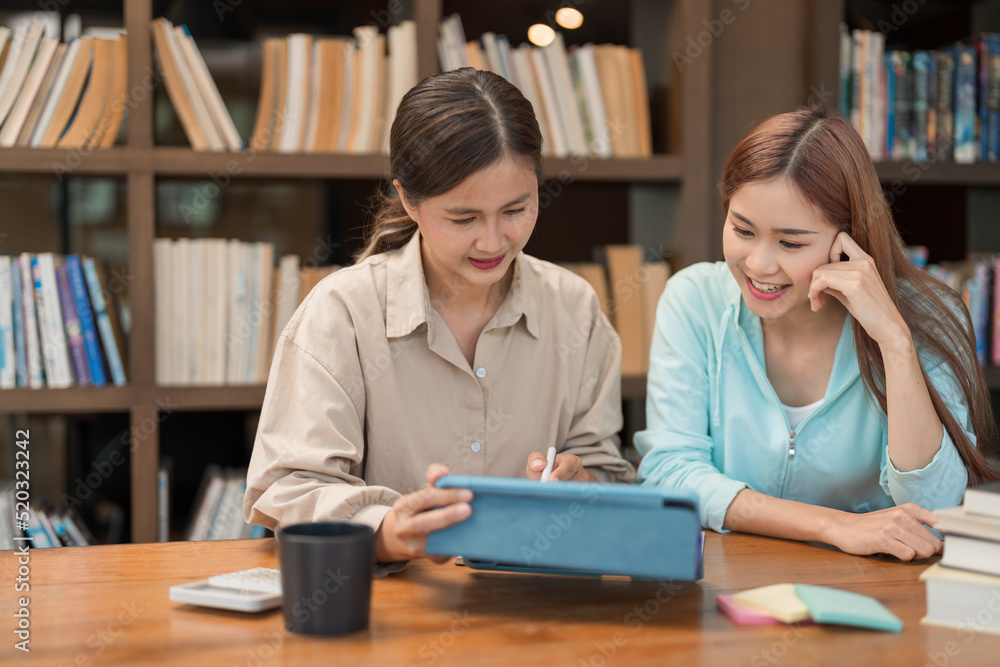 Fotografie Education concept, Female tutor pointing math quiz on tablet and explaining math