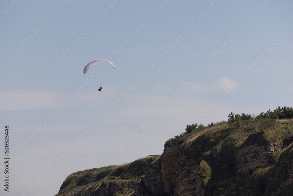 paragliding on cliffs in Normandy near Omaha Beach paragliding on cliffs in Normandy near Omaha Beach