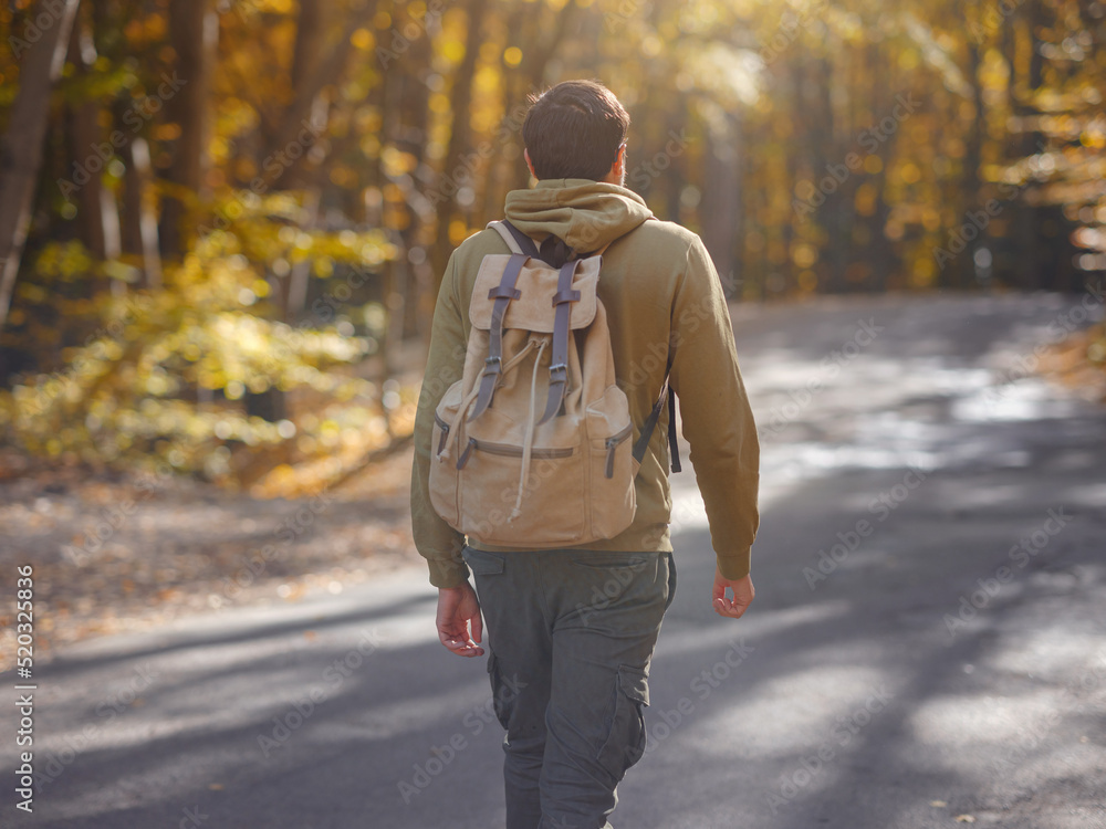 Young handsome man posing in autumn forest. Young handsome man posing in autumn forest.