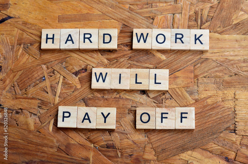hard work will pay off text on wooden square, motivation quotes