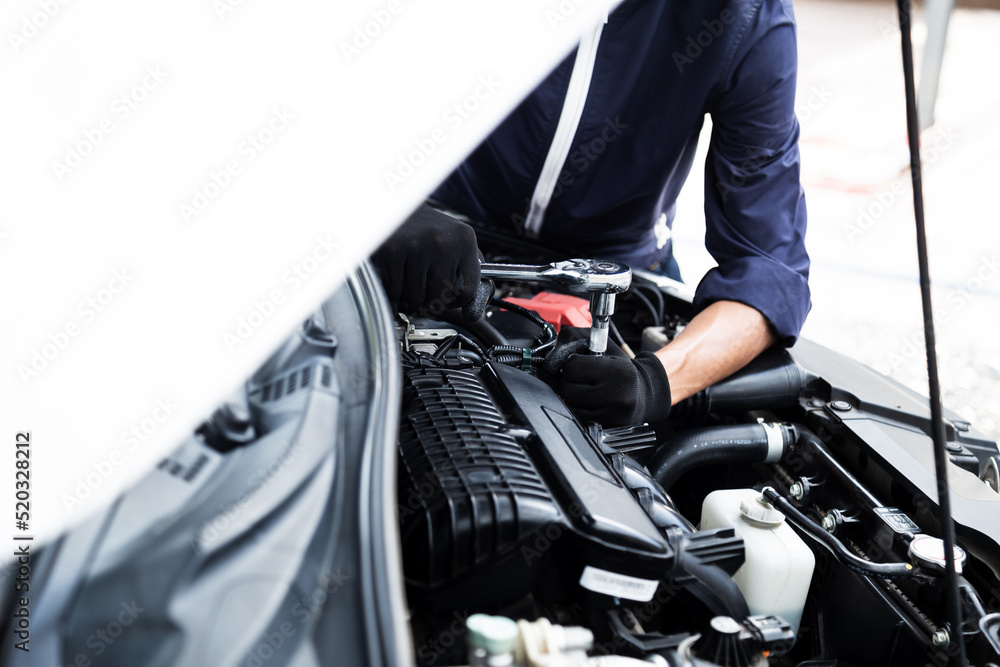 Automobile mechanic repairman hands repairing a car engine automotive workshop with a wrench, car service and maintenance , Repair service Automobile mechanic repairman hands repairing a car engine automotive workshop with a wrench, car service and maintenance , Repair service