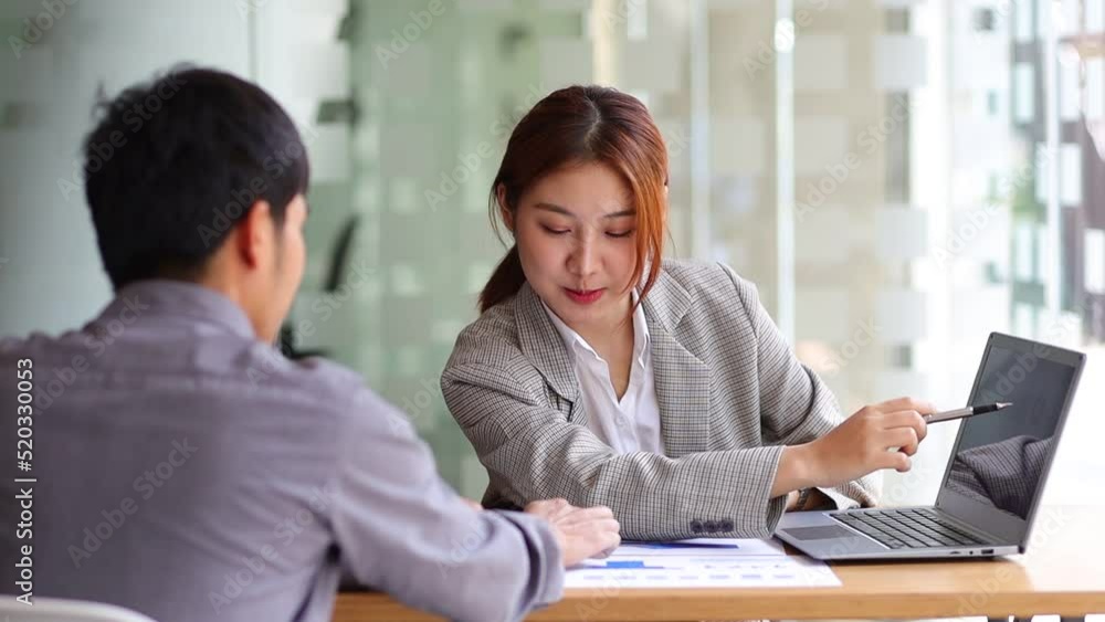 Businesswoman discussing projects and analyzing business planning with office colleagues. Businesswoman discussing projects and analyzing business planning with office colleagues.