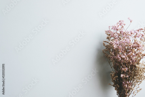 Purple Dried Caspia and Dried Statice flowers bouquet on a gray background, Caspian dried flowers in the bouquet, Vintage Style, wallpaper, empty, emotional, sentimental text, Mockup for positive idea