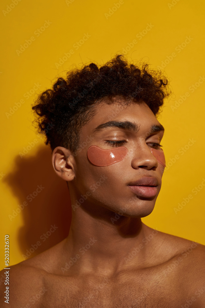 Partial of guy with under eye patches on face Partial of guy with under eye patches on face