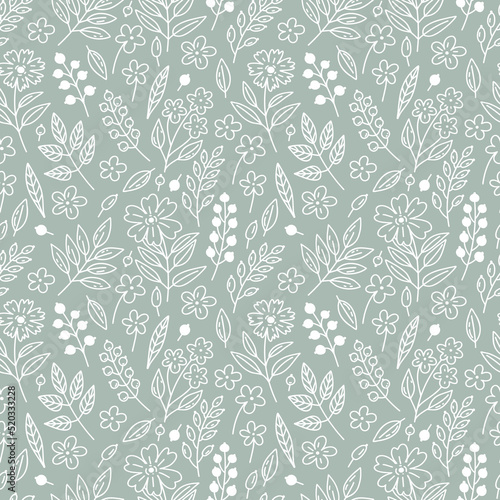 Seamless floral pattern with white berries, leaves and flowers on a blue-gray background in doodle style. Delicate, boho floral texture for fabrics, textiles, wallpaper, paper.