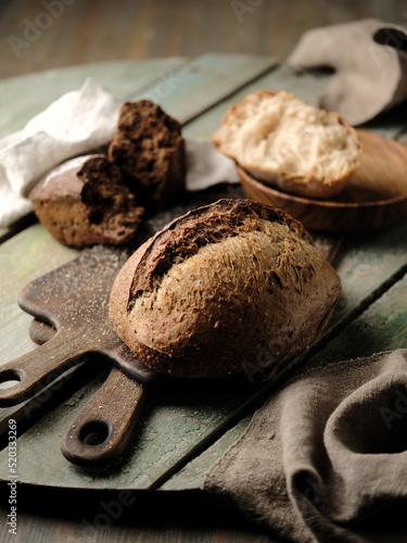 Dark rye bread on the table, food photography.