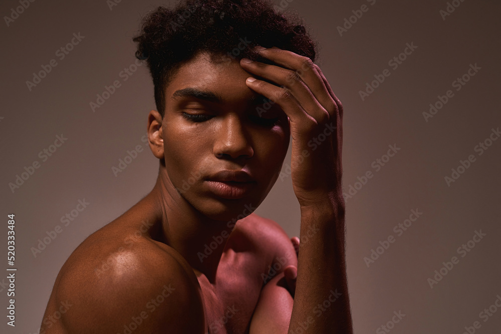 Black beautiful guy posing with closed eyes Black beautiful guy posing with closed eyes
