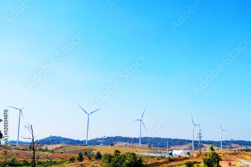 Landscape view of Wind turbines farms on a hill in the rural areas that the clean energy system in Khao Kho District, Phetchabun, Thailand, Wind turbines for clean electrical energy in the clear sky.