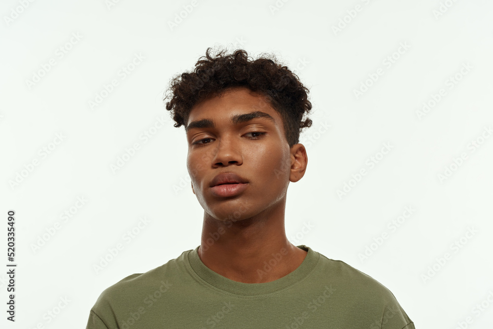 Portrait of concentrated curly black handsome guy Portrait of concentrated curly black handsome guy