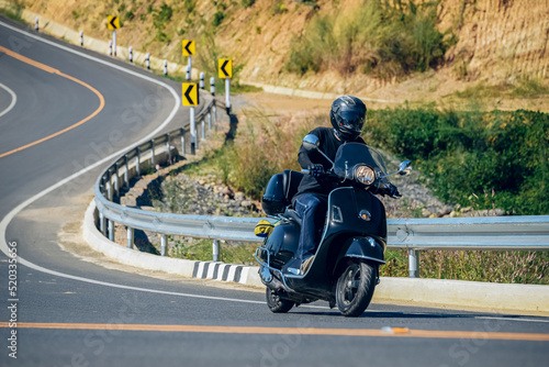 motorcycle on the road rides away. Travel on vacation, enjoy the nature trail