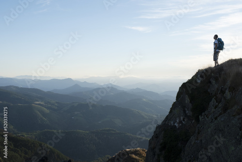 person who has reached the top of the mountain, has overcome all the difficulties and now enjoys the view. © poliki