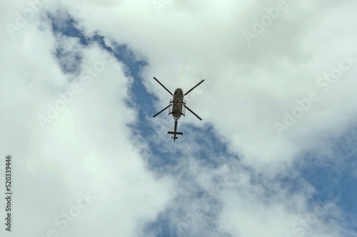 A helicopter is flying low overhead