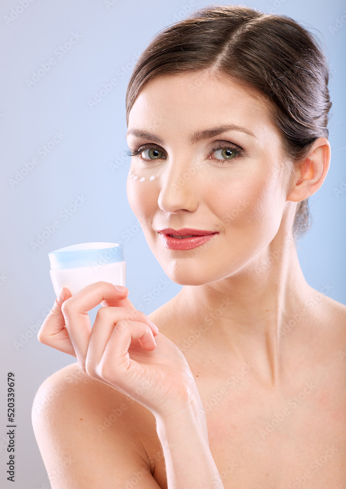 Isolated beauty woman with natural skin and bare shoulders holding cream jar. studio female portrait in beauty style. Isolated beauty woman with natural skin and bare shoulders holding cream jar. studio female portrait in beauty style.