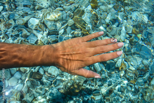 Fototapeta Naklejka Na Ścianę i Meble -  hand in water