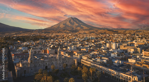 Aerial drone view of Arequipa main square and cathedral church, with the Misti volcano at sunset. Arequipa, Peru. photo