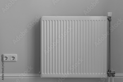 Steel panel heating radiator in the room
