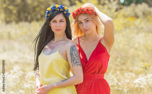 Women in ethnic dresses, flower wreath in hair. Concept of beauty Slavic women, Boho romantic style