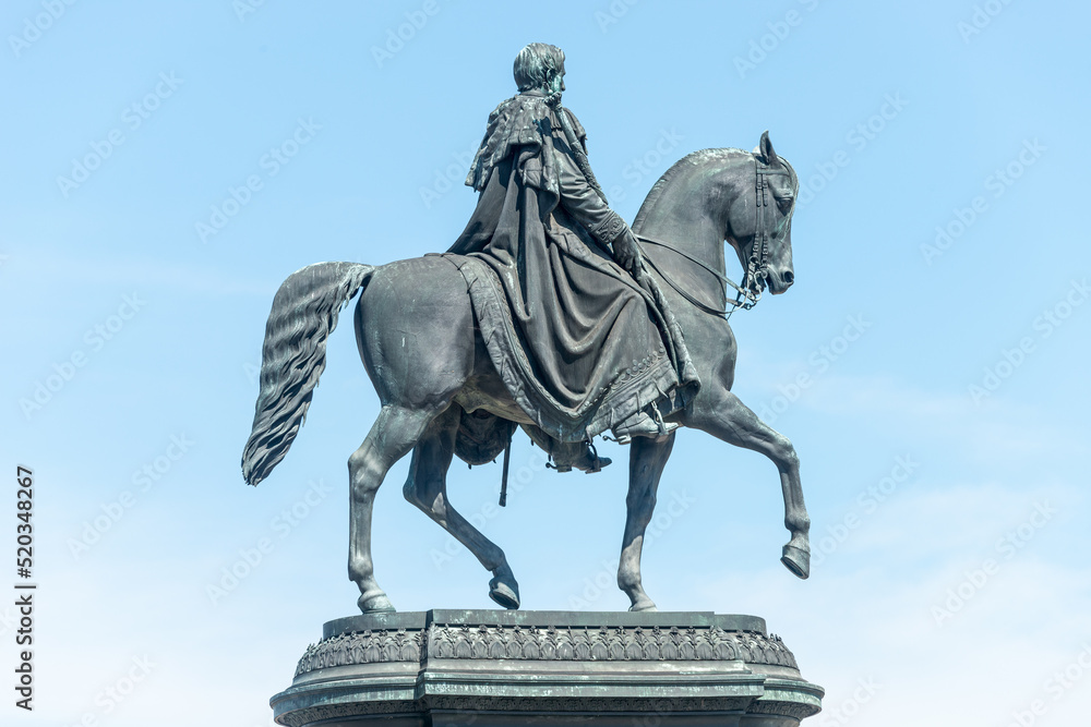 Obraz premium Cityscape over historical and touristic center in Dresden downtown and Statue of King Johann near Cathedral of Holy Trinity and State Opera, Dresden, Germany, at summer sunny day and blue sky.