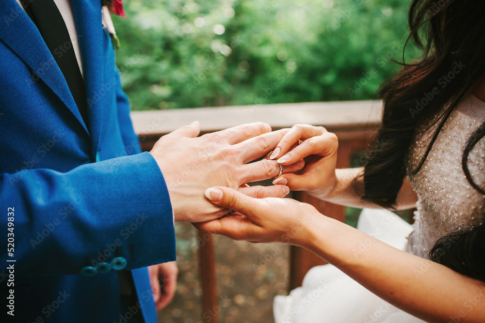 Bride and groom exchange rings at the wedding ceremony Bride and groom exchange rings at the wedding ceremony