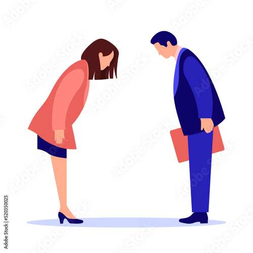 a man and a woman in business suits met and greeted with a low bow