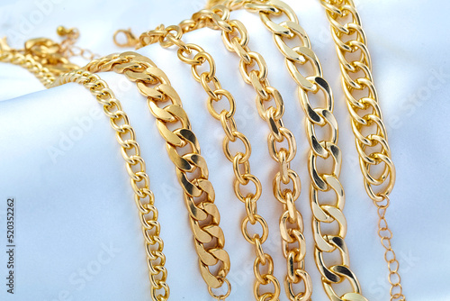 Gold jewelry on white background