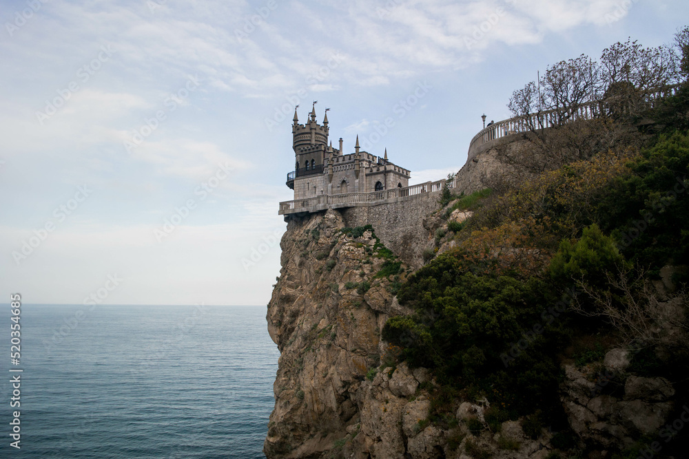 Gothic castle on a cliff overlooking the sea