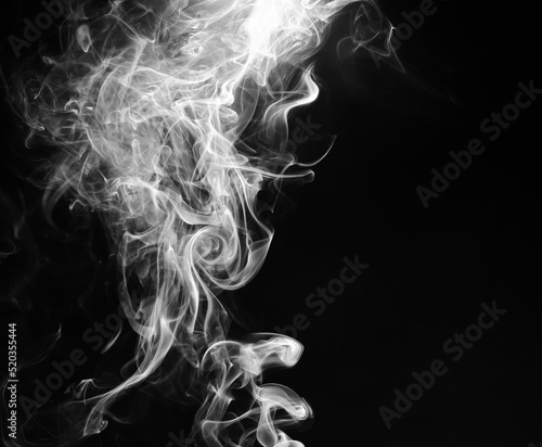 abstract fragment movement of white smoke on black background. © thithawat