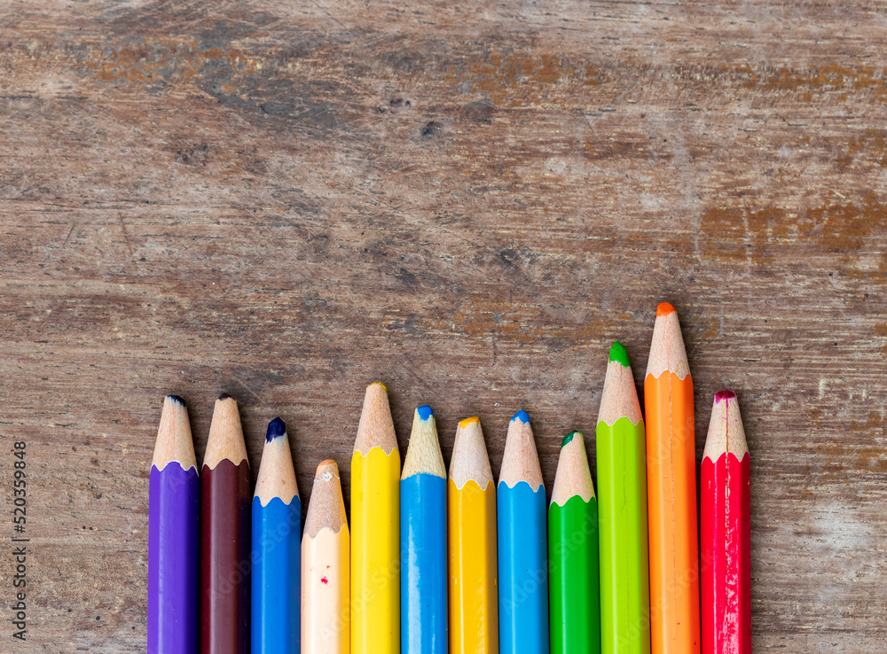 blunt coloured pencils on wood floor. blunt coloured pencils on wood floor.
