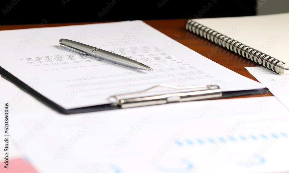 Financial charts on office desk. Home office work space. financial accounting strategy analysis concept Financial charts on office desk. Home office work space. financial accounting strategy analysis concept