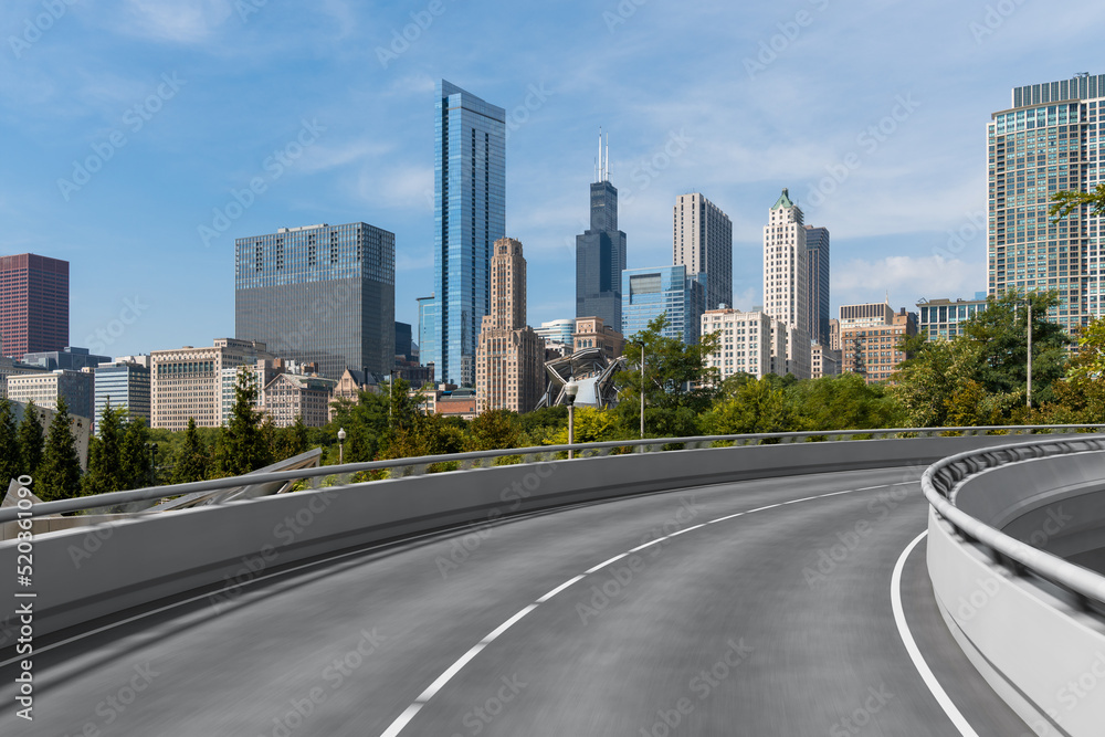 Empty urban asphalt road exterior with city buildings background. New modern highway concrete construction. Concept of way to success. Transportation logistic industry fast delivery. Chicago. USA.