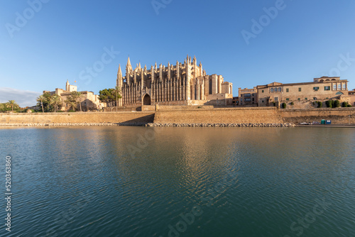 Palma de Mallorca, Spain. Facade and rose window called Ojo del Gotico (Gothic Eye) of the Santa Maria Cathedral, and Parc de la Mar